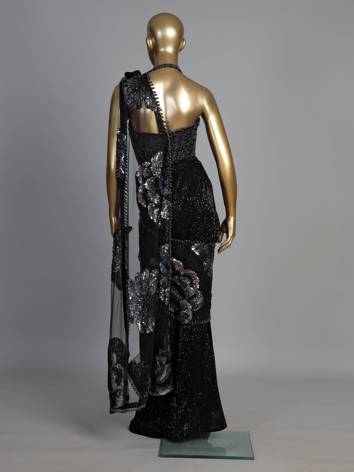 Black sequined net saree with halter blouse