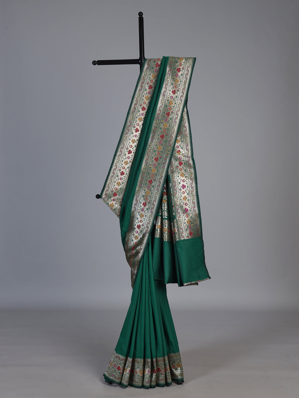 Green paithani silk saree with floral motifs and rich zari