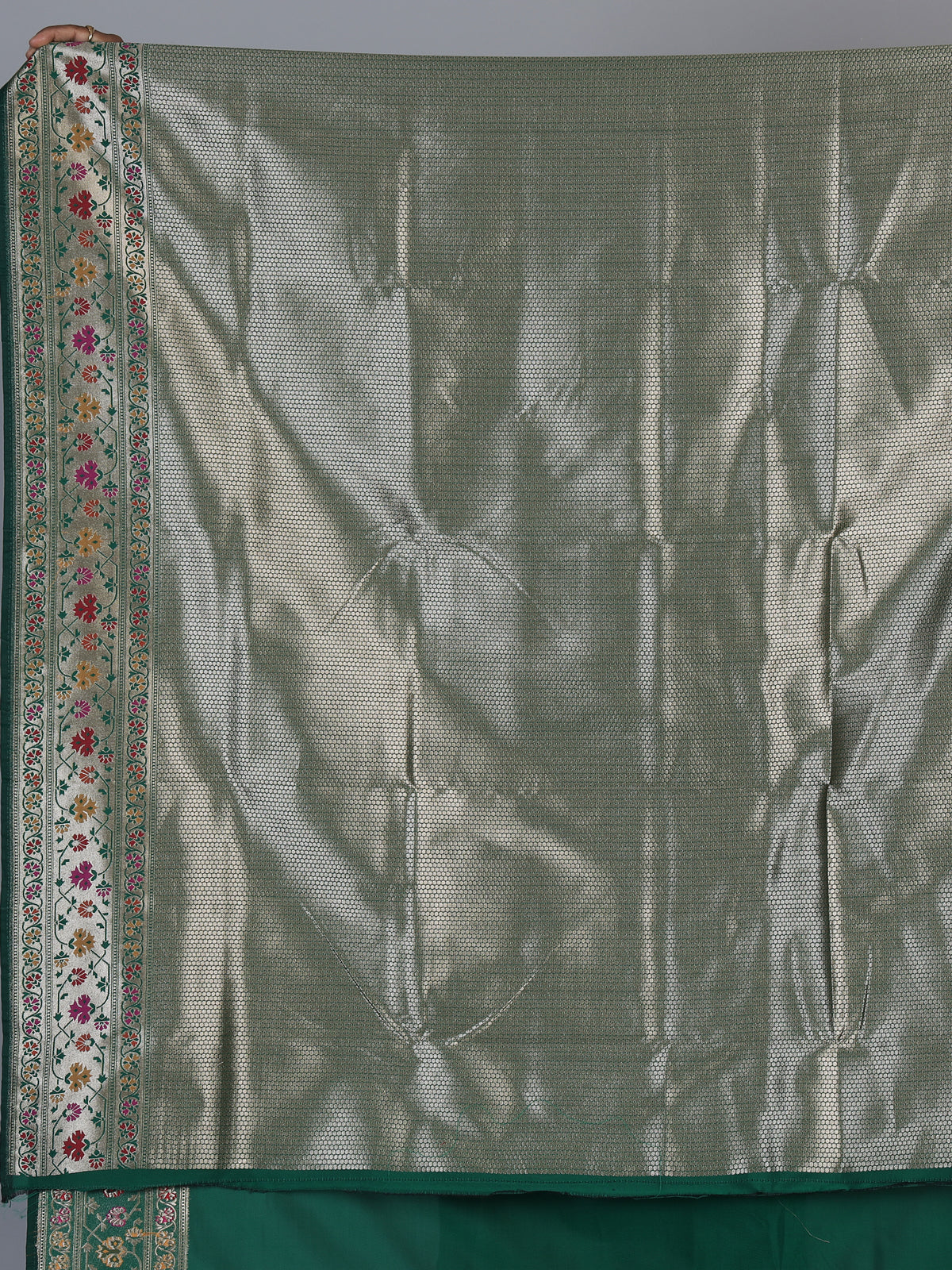 Green paithani silk saree with floral motifs and rich zari