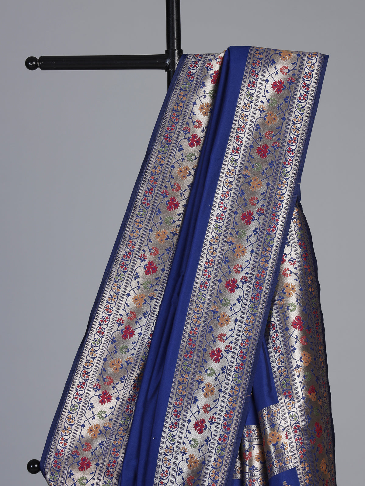 Blue paithani silk saree with floral motifs and zari elegance