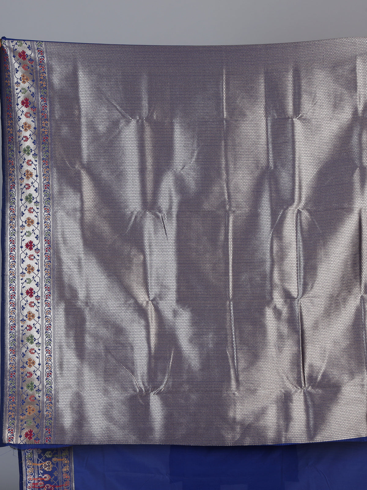 Blue paithani silk saree with floral motifs and zari elegance