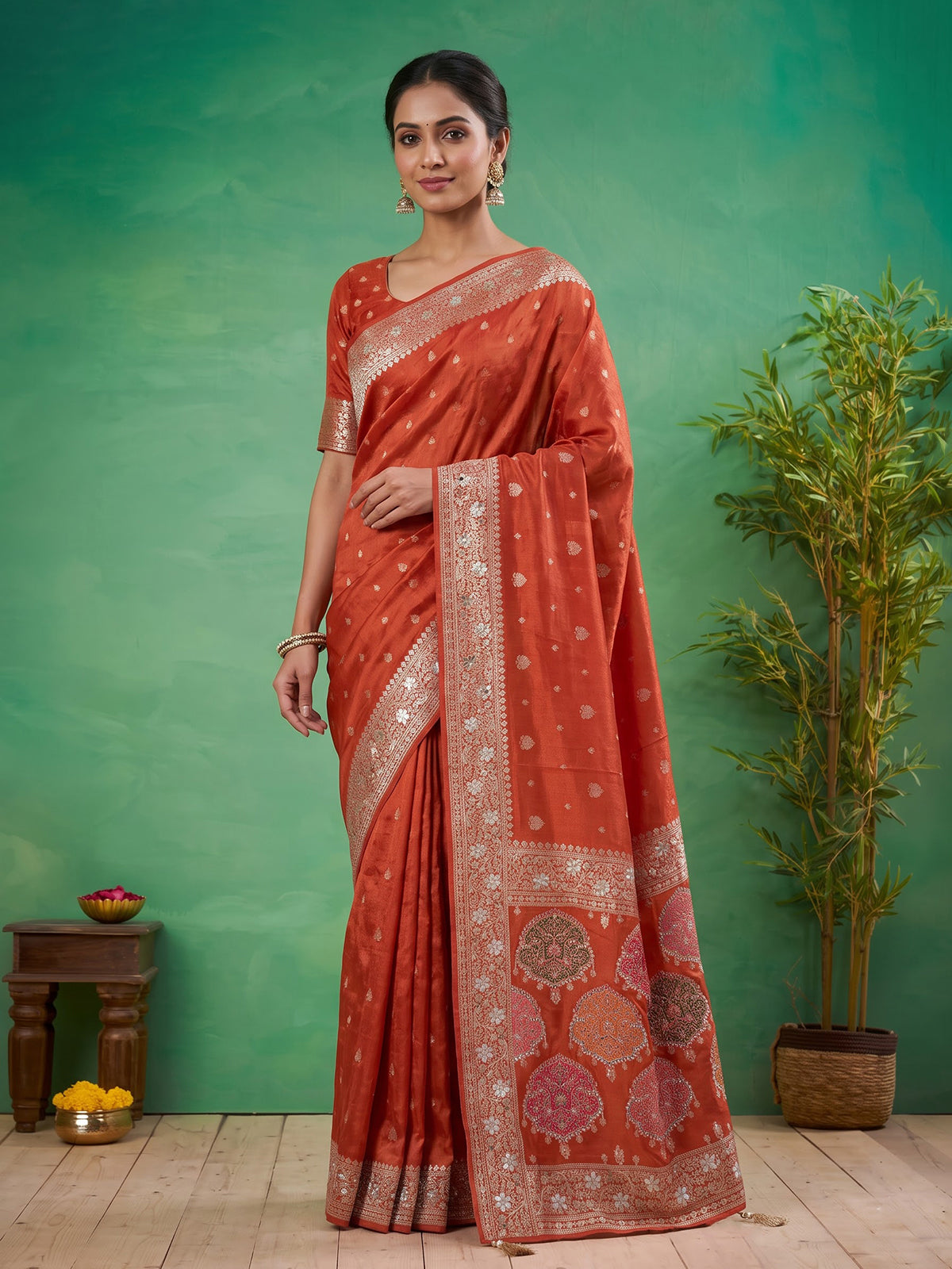Rust orange dola silk saree with floral butti handwork