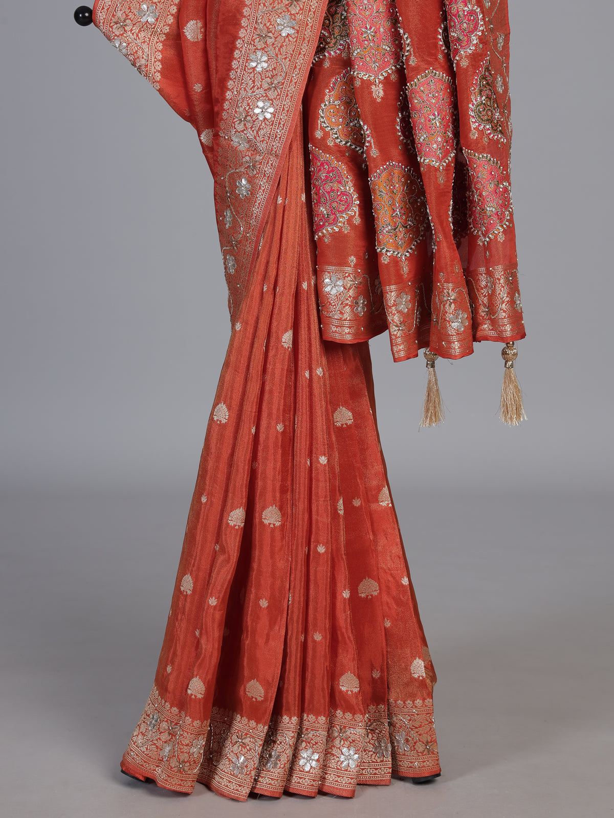 Rust orange dola silk saree with floral butti handwork