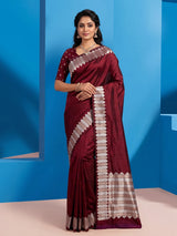 Maroon satin silk saree with elegant zari border and pallu