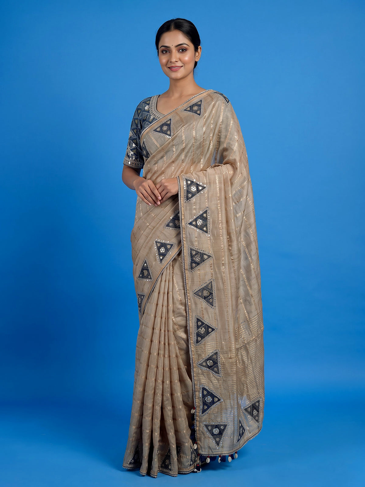 Beige tusser silk saree with regal zardosi embellishments