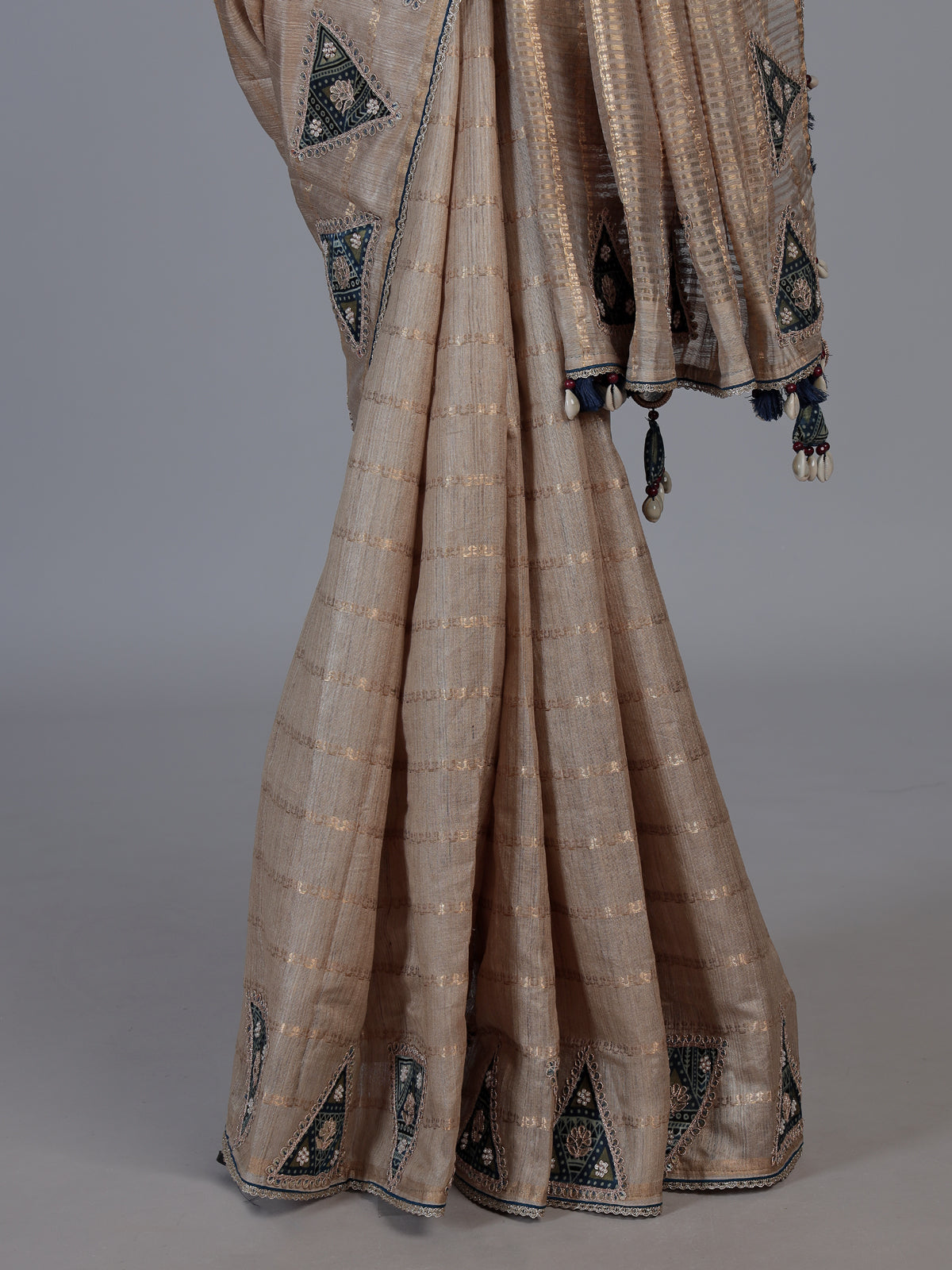 Beige tusser silk saree with regal zardosi embellishments