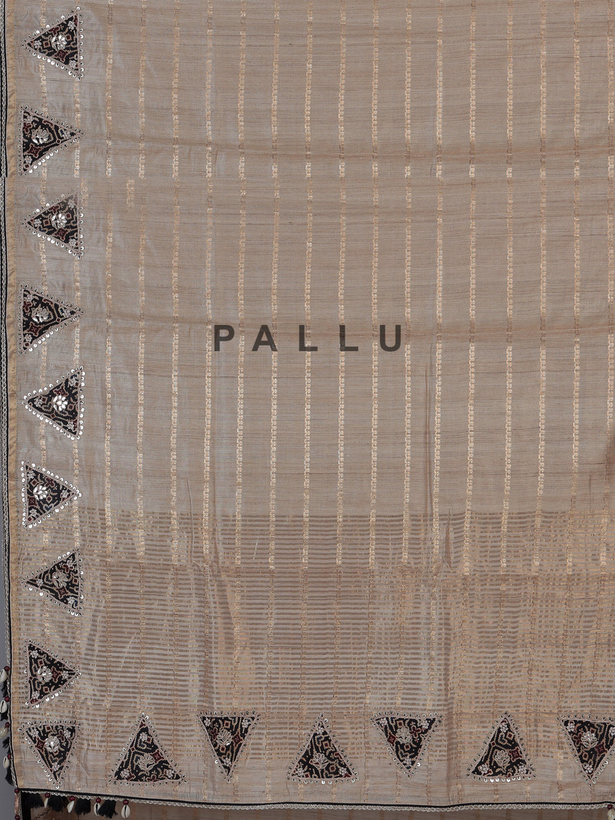 Pastel beige tusser silk saree with traditional handcrafted embellishments