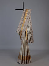 Pastel beige tissue silk saree with bird motif