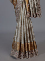 Pastel beige tissue silk saree with bird motif