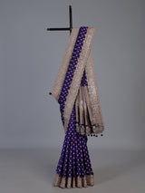 Blue banarasi silk saree with elegant butti and handwork design