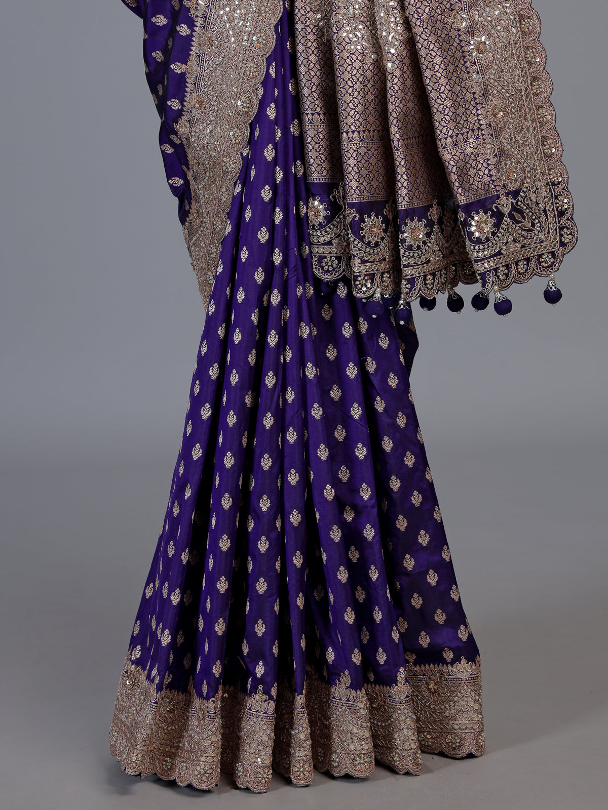 Blue banarasi silk saree with elegant butti and handwork design