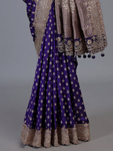 Blue banarasi silk saree with elegant butti and handwork design