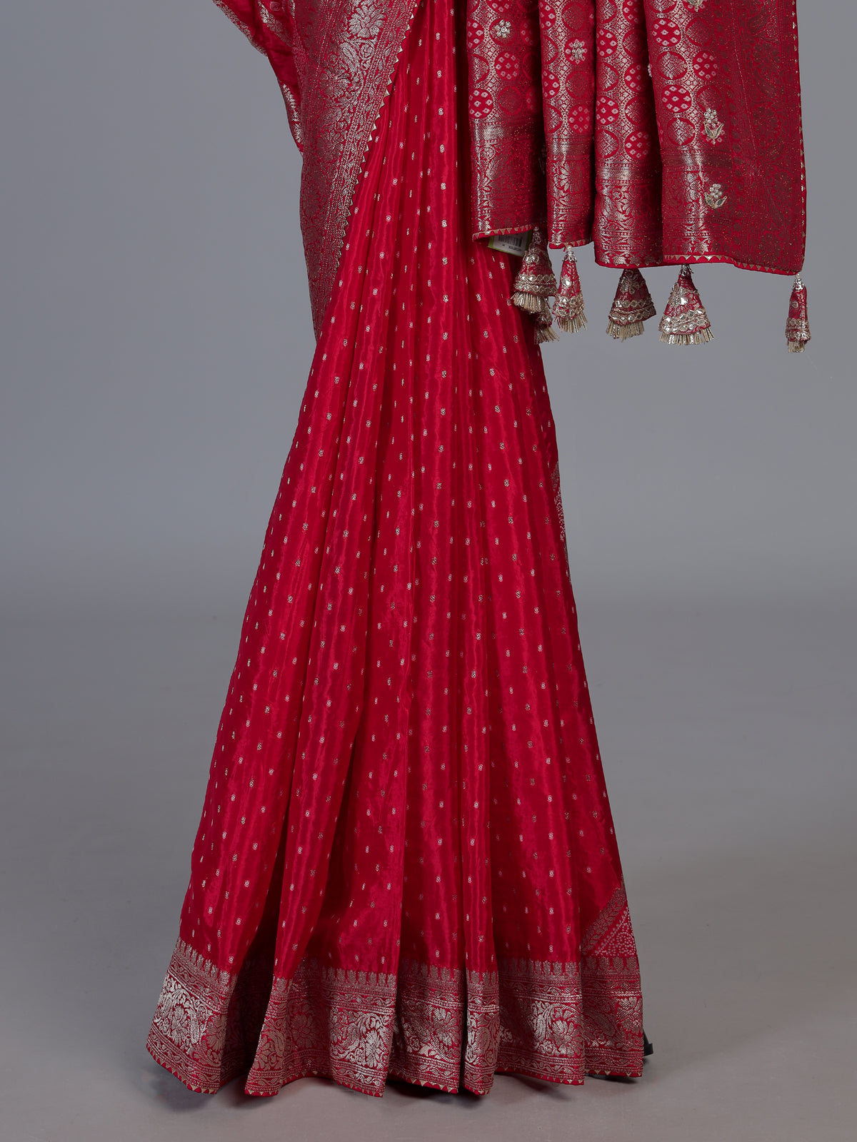 Red satin dola silk saree with elegant butti handwork