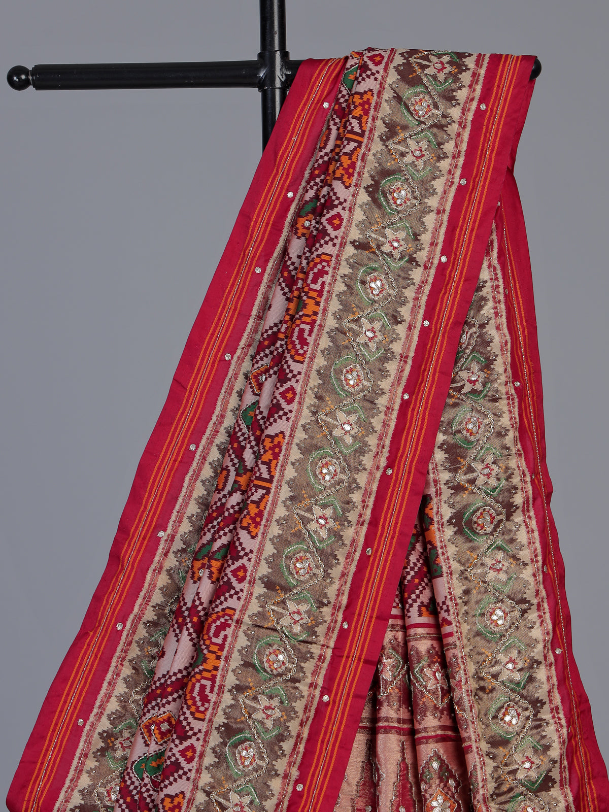 Red art patola silk saree with exquisite handcrafted embellishments