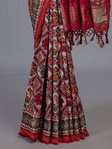 Red art patola silk saree with exquisite handcrafted embellishments