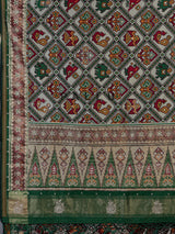 Green art patola silk saree with rich zardosi handwork