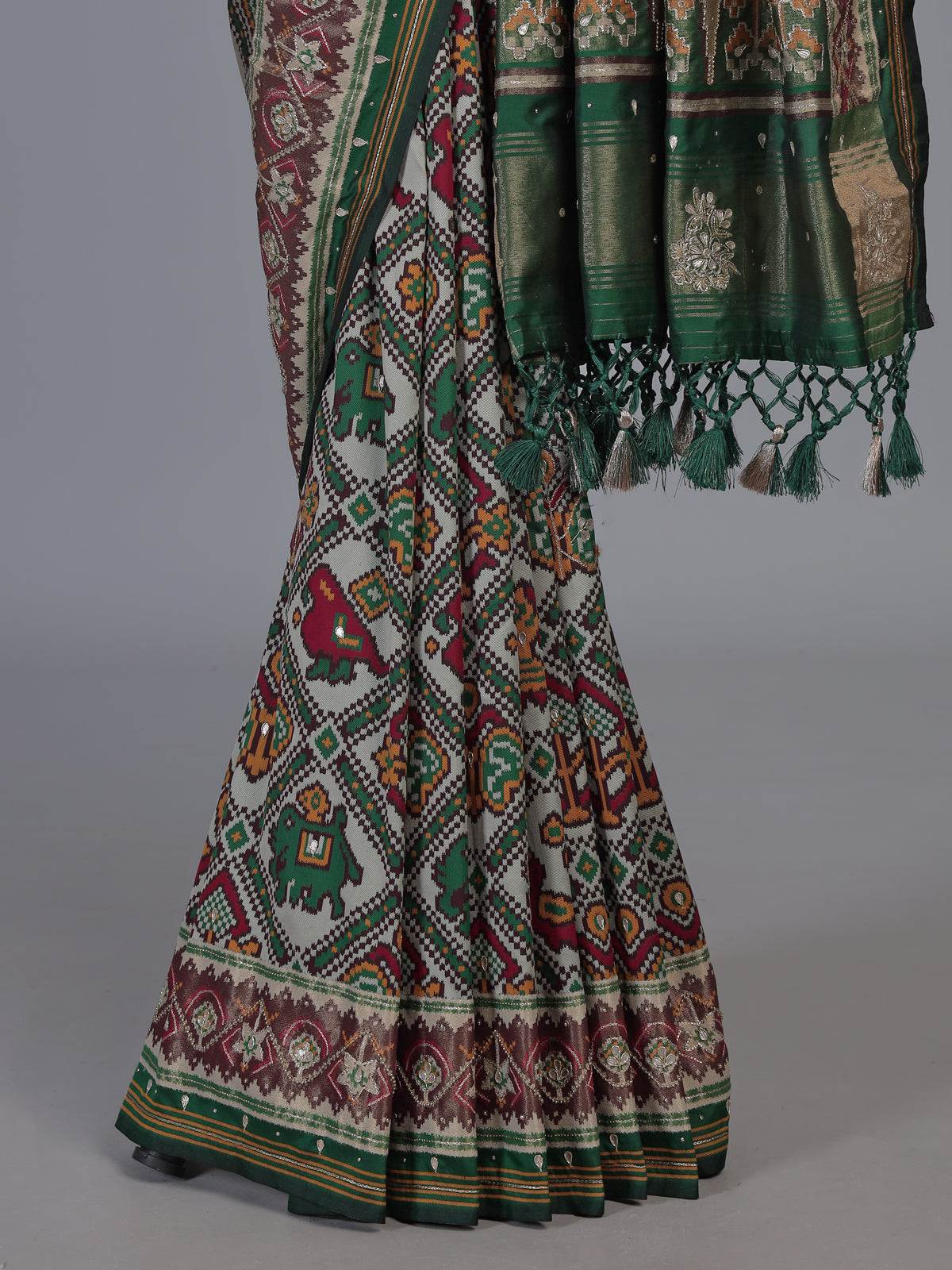 Green art patola silk saree with rich zardosi handwork