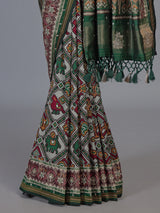 Green art patola silk saree with rich zardosi handwork