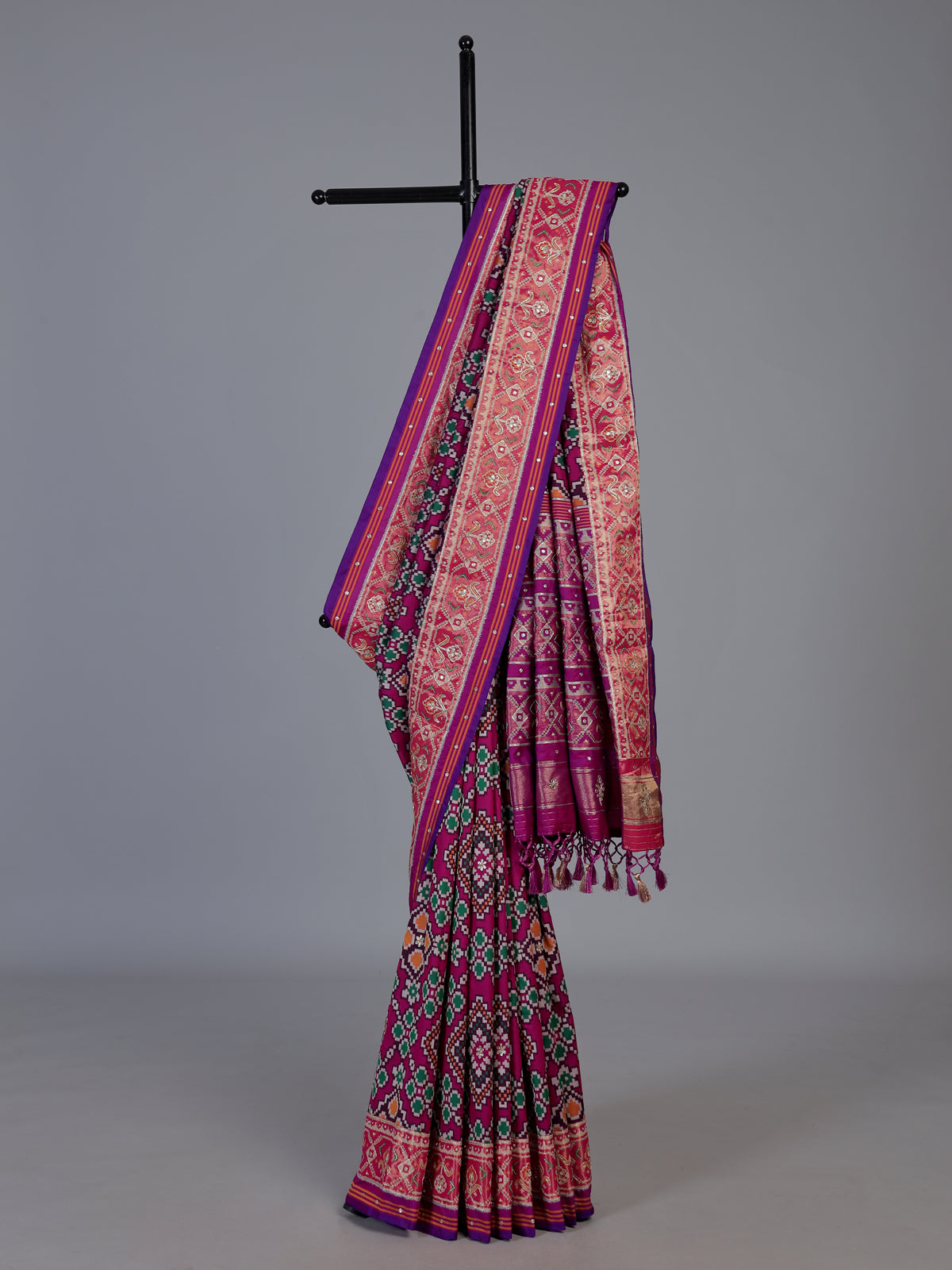 Magenta art patola silk saree with stone embellished elegance
