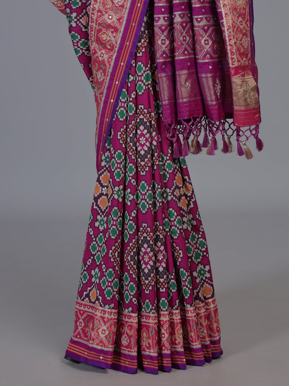 Magenta art patola silk saree with stone embellished elegance