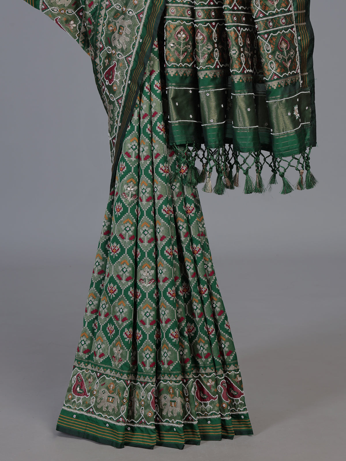 Green art patola silk saree with traditional motif handwork
