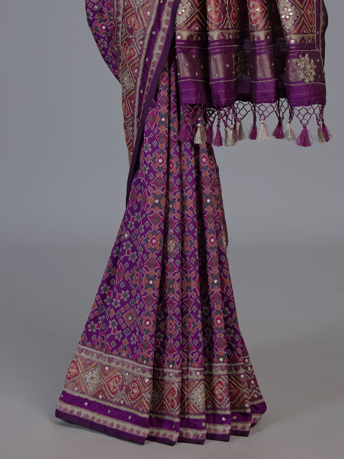 Purple art patola silk saree with rich zardosi detailing