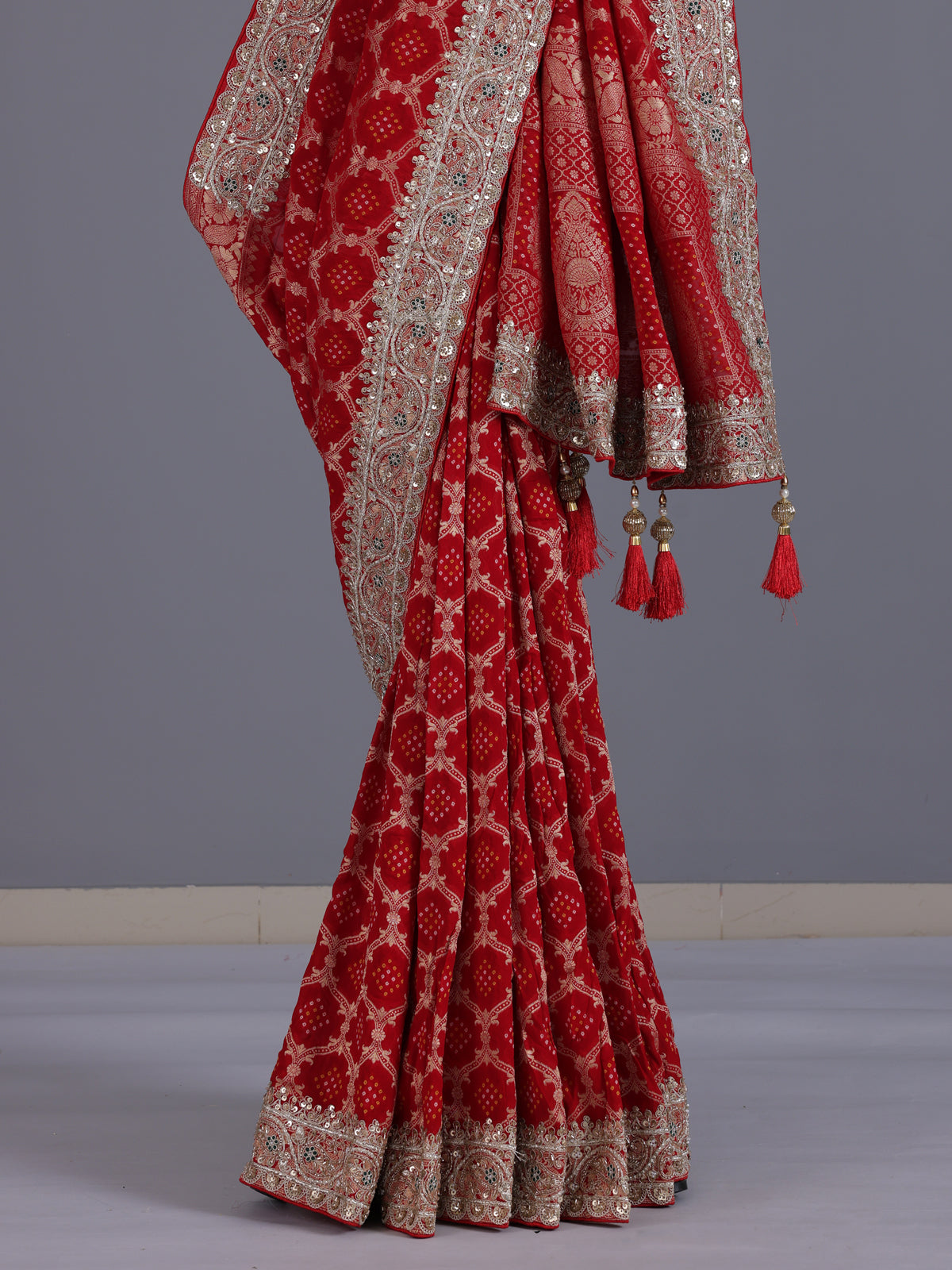 Red bandhani semi georgette saree with designer tassel pallu elegance