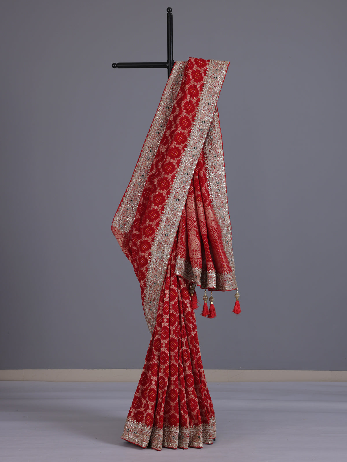 Red bandhani semi georgette saree with designer tassel pallu elegance