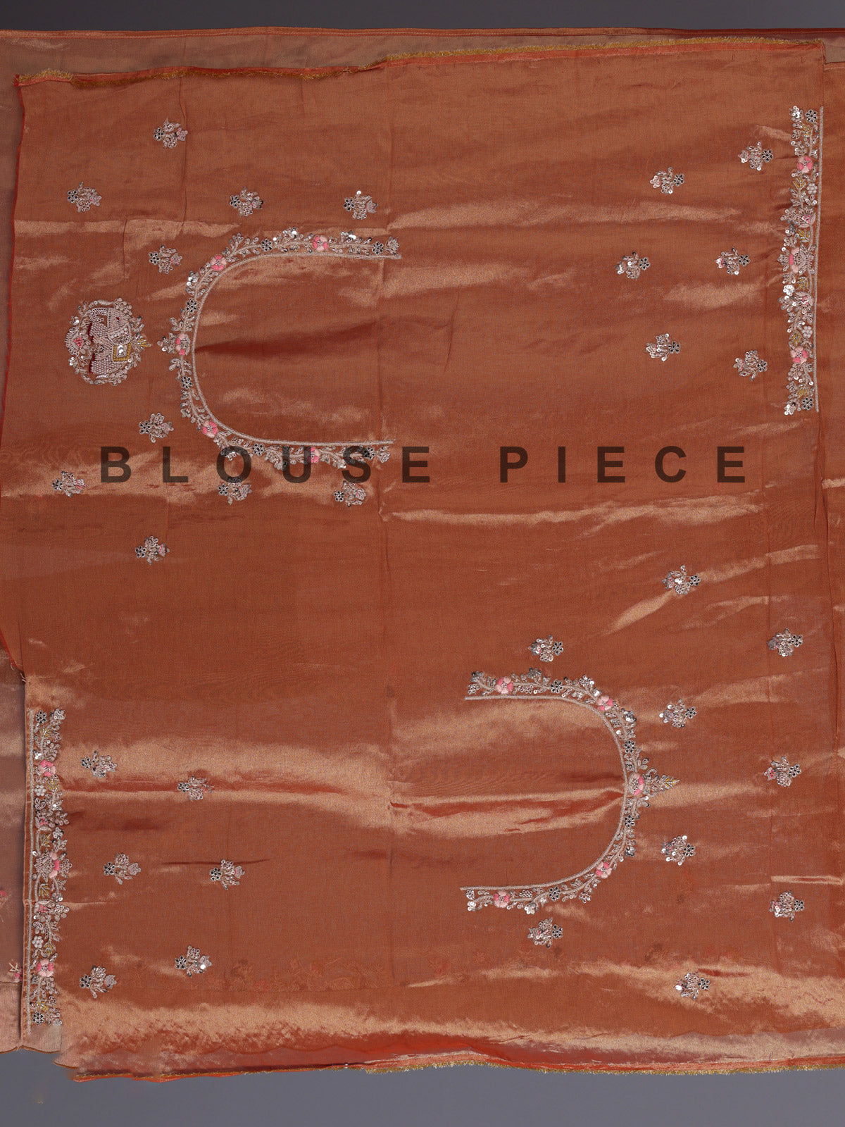 Pastel orange tissue silk saree with elephant border festive elegance