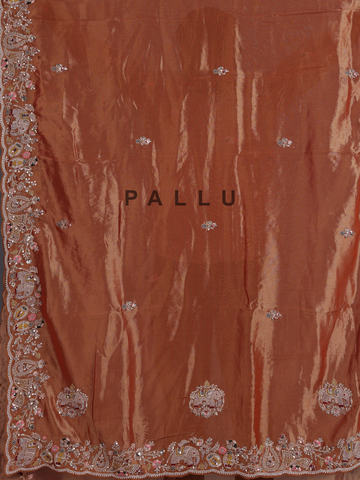 Pastel orange tissue silk saree with elephant border festive elegance