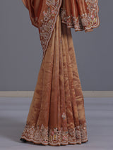 Pastel orange tissue silk saree with elephant border festive elegance