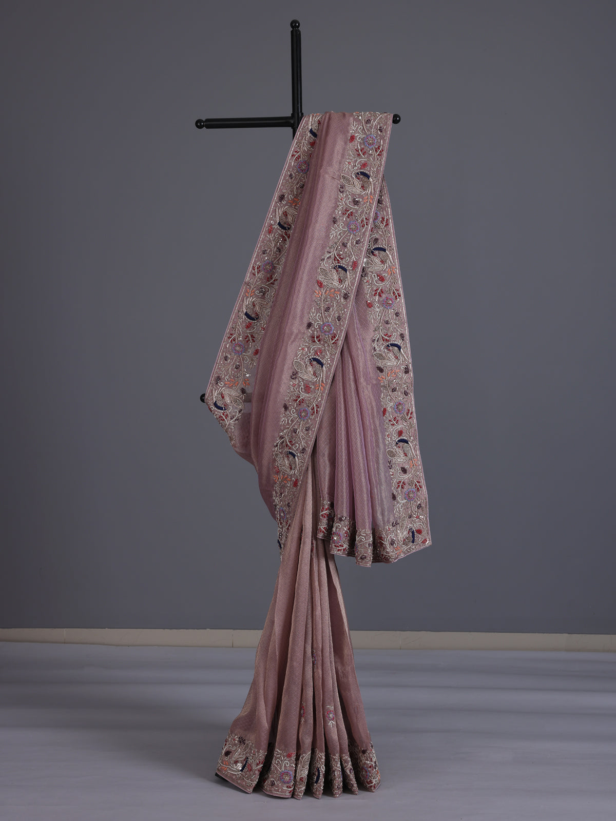 Pastel pink shimmer tissue saree with peacock border designer elegance