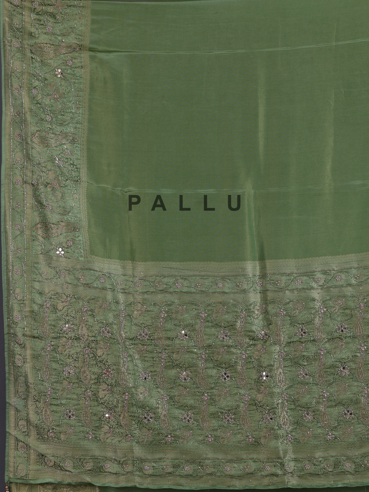 Pastel pista green shimmer dola silk saree with peacock motifs