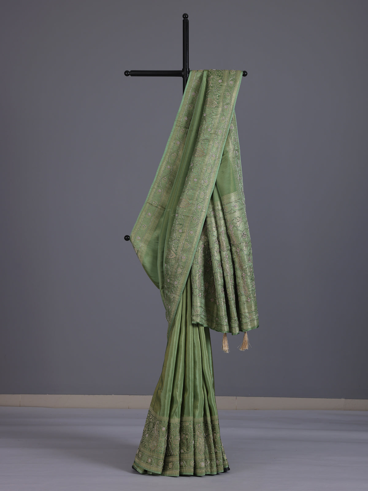 Pastel pista green shimmer dola silk saree with peacock motifs
