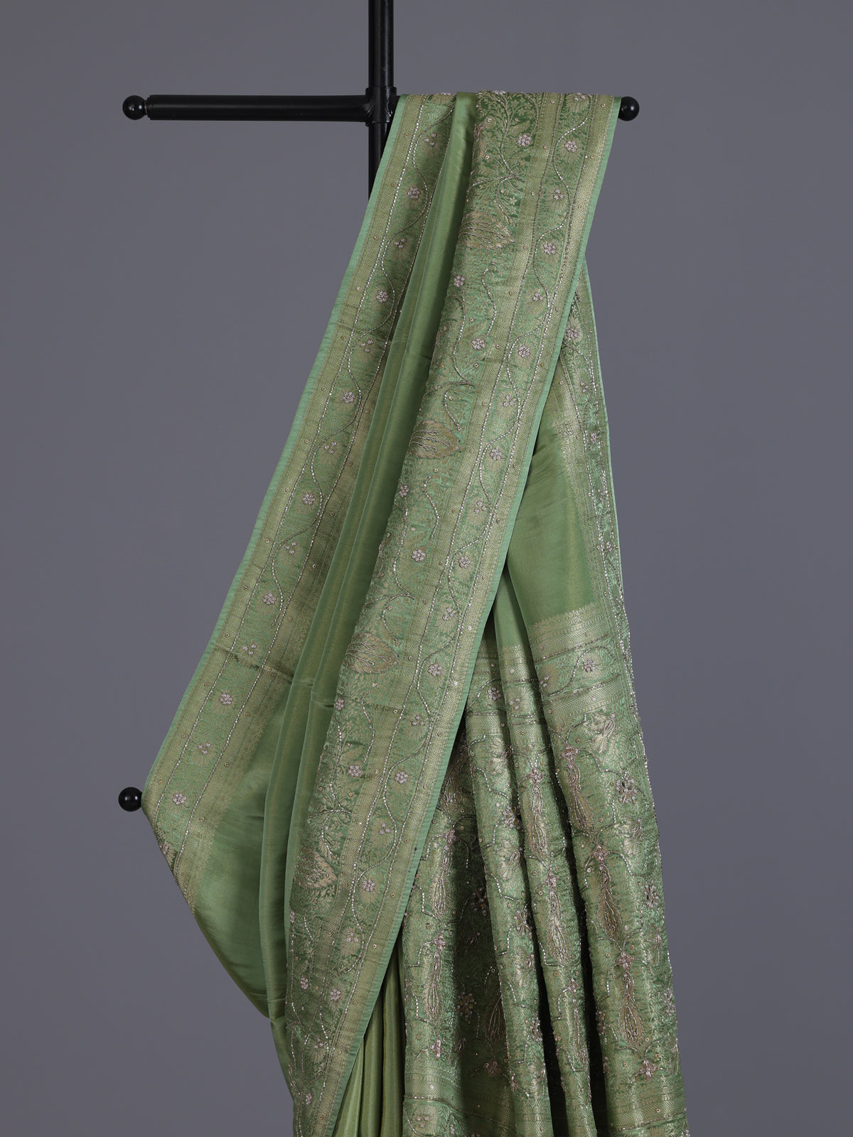 Pastel pista green shimmer dola silk saree with peacock motifs