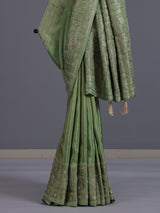 Pastel pista green shimmer dola silk saree with peacock motifs