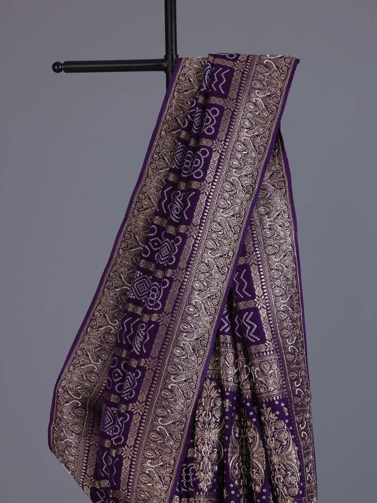 Purple dola silk bandhani saree with luxurious tassel pallu detailing