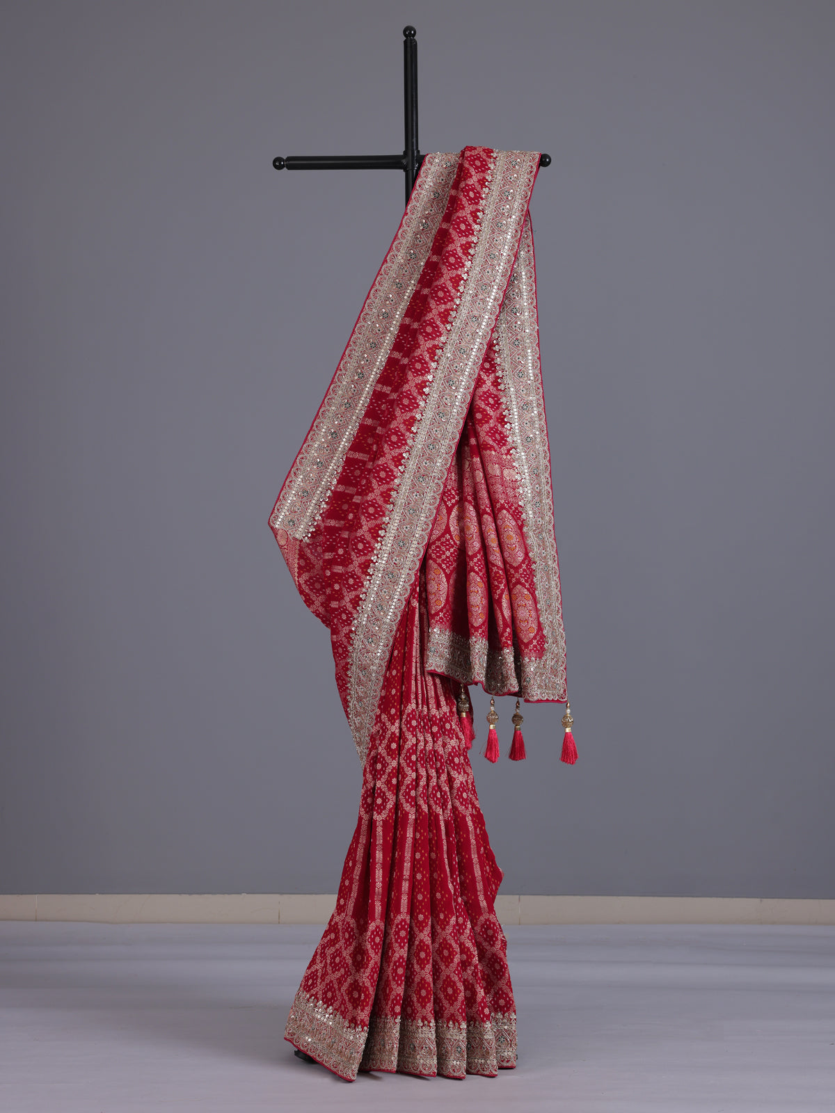 Rani pink semi georgette bandhani saree with festive tassel pallu