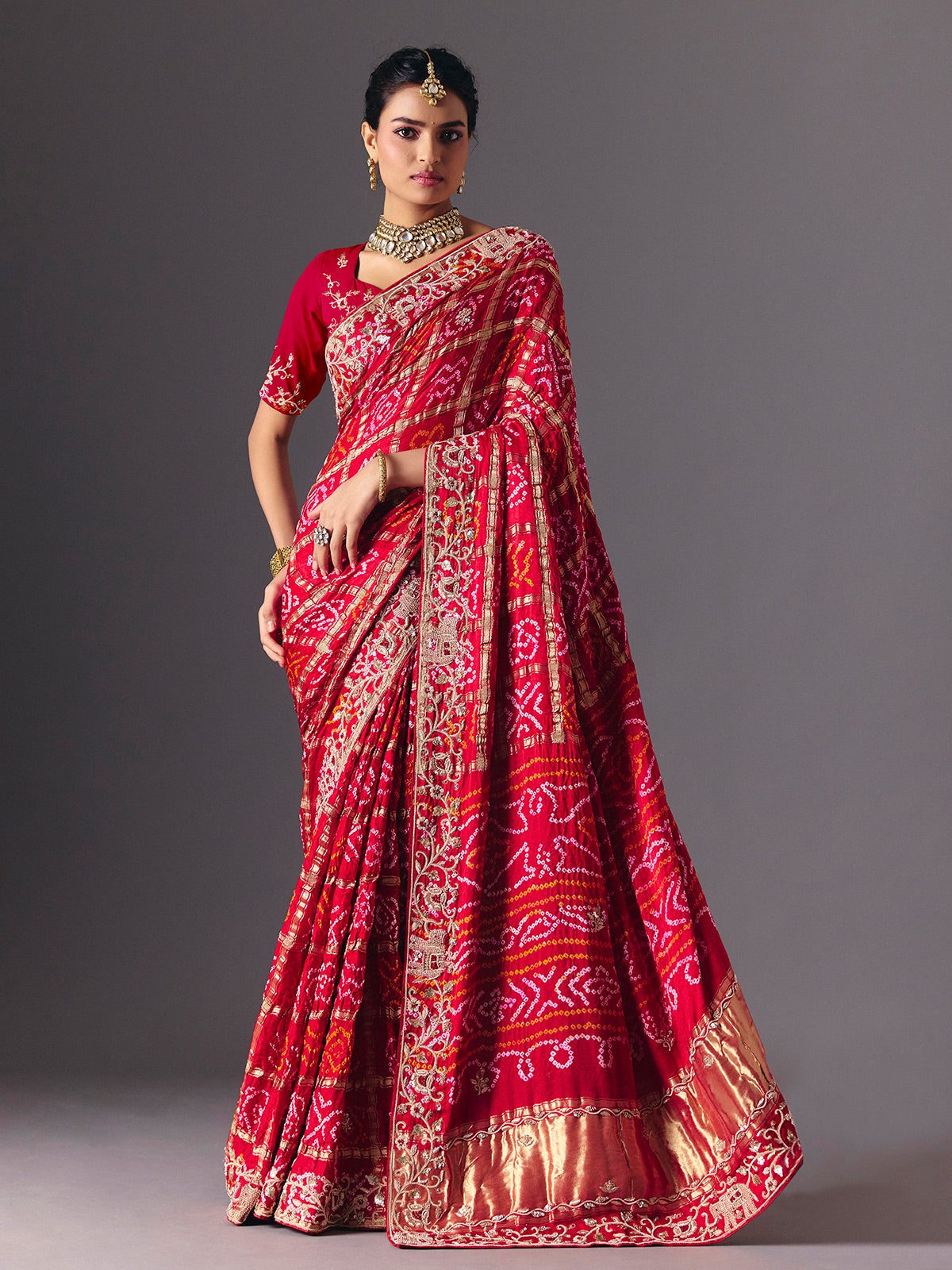 Red traditional bandhani silk bridal saree with elegance