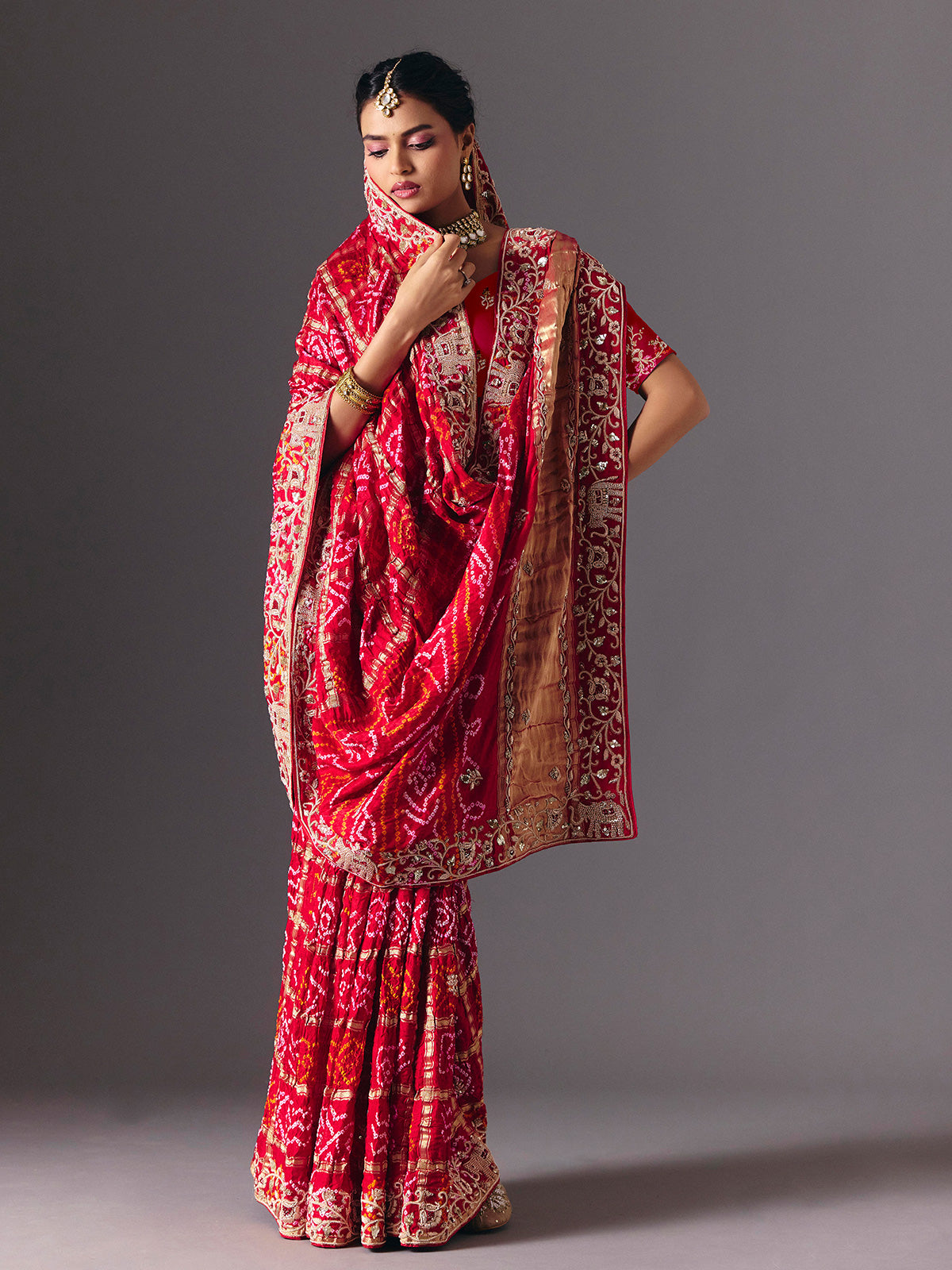 Red traditional bandhani silk bridal saree with elegance