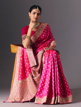 Rani pink banarasi silk saree with butti work and tassels