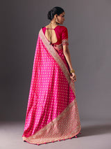 Rani pink banarasi silk saree with butti work and tassels