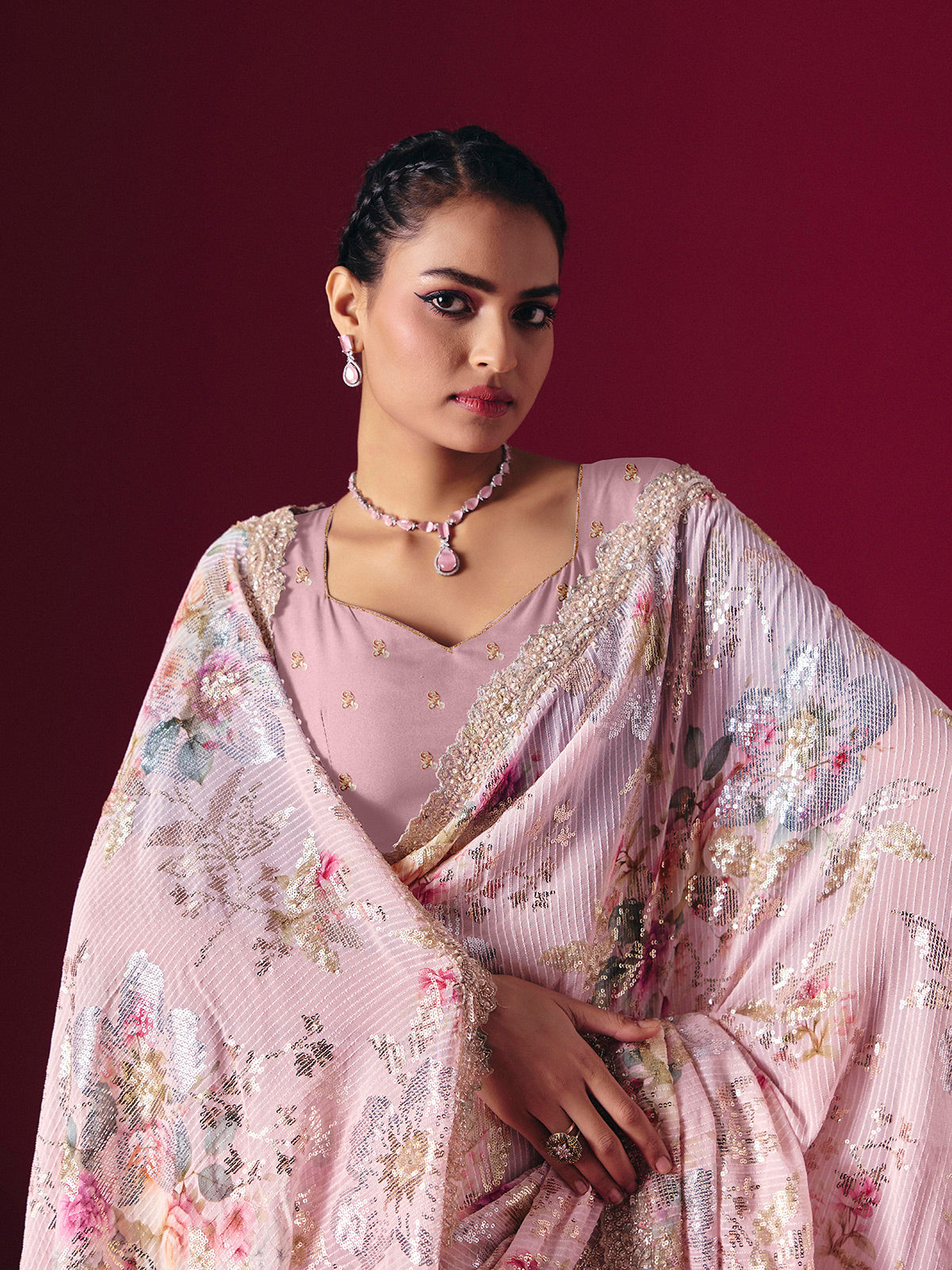 Dusty pink printed georgette saree with elegant embellished festive detailing