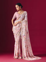 Dusty pink printed georgette saree with elegant embellished festive detailing
