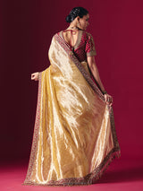 Pastel yellow tissue silk saree with luxurious zari zardosi embellishments
