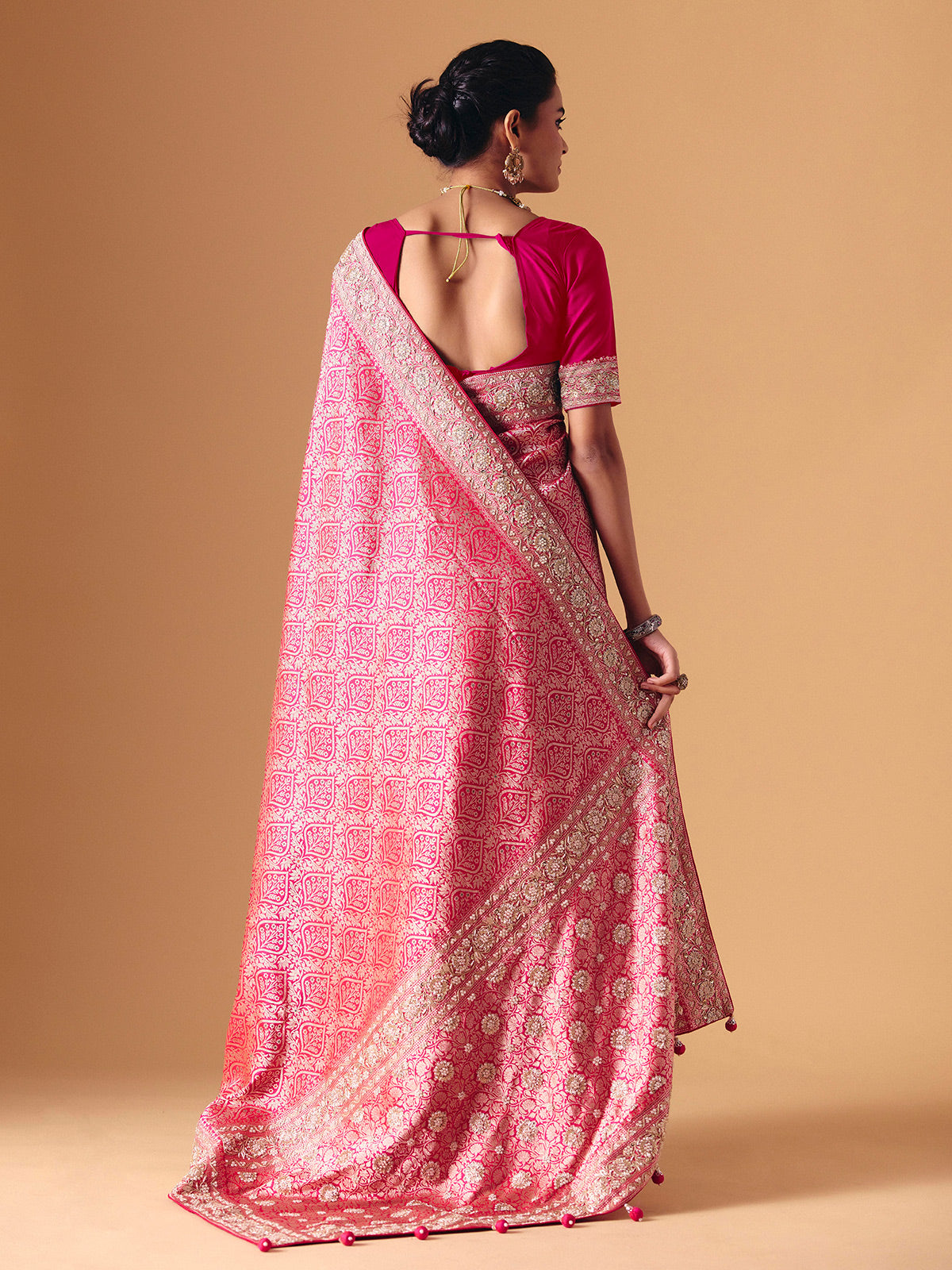 Magenta pink banarasi silk saree with regal embellished bridal elegance