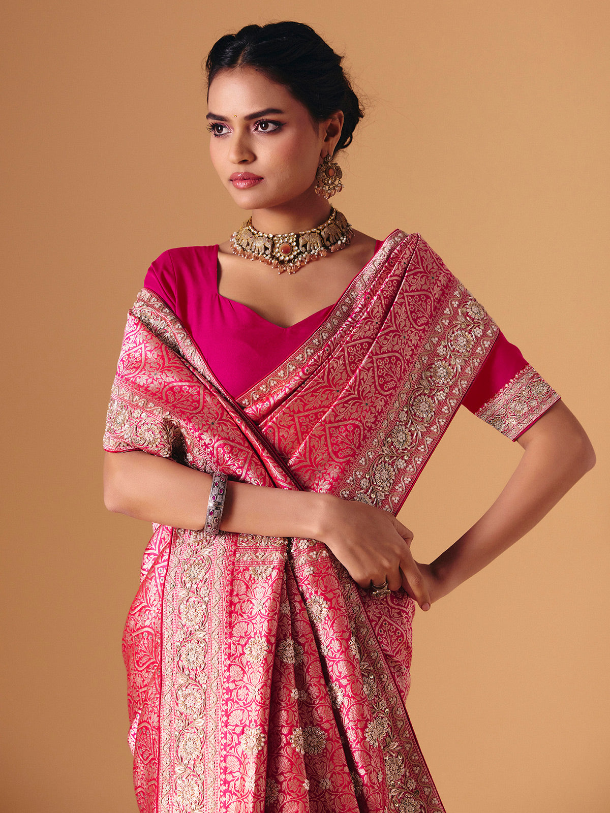 Magenta pink banarasi silk saree with regal embellished bridal elegance