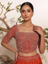 Rust orange silk embellished designer lehenga choli with tassel dupatta