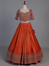 Rust orange silk embellished designer lehenga choli with tassel dupatta