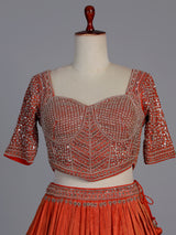 Rust orange silk embellished designer lehenga choli with tassel dupatta